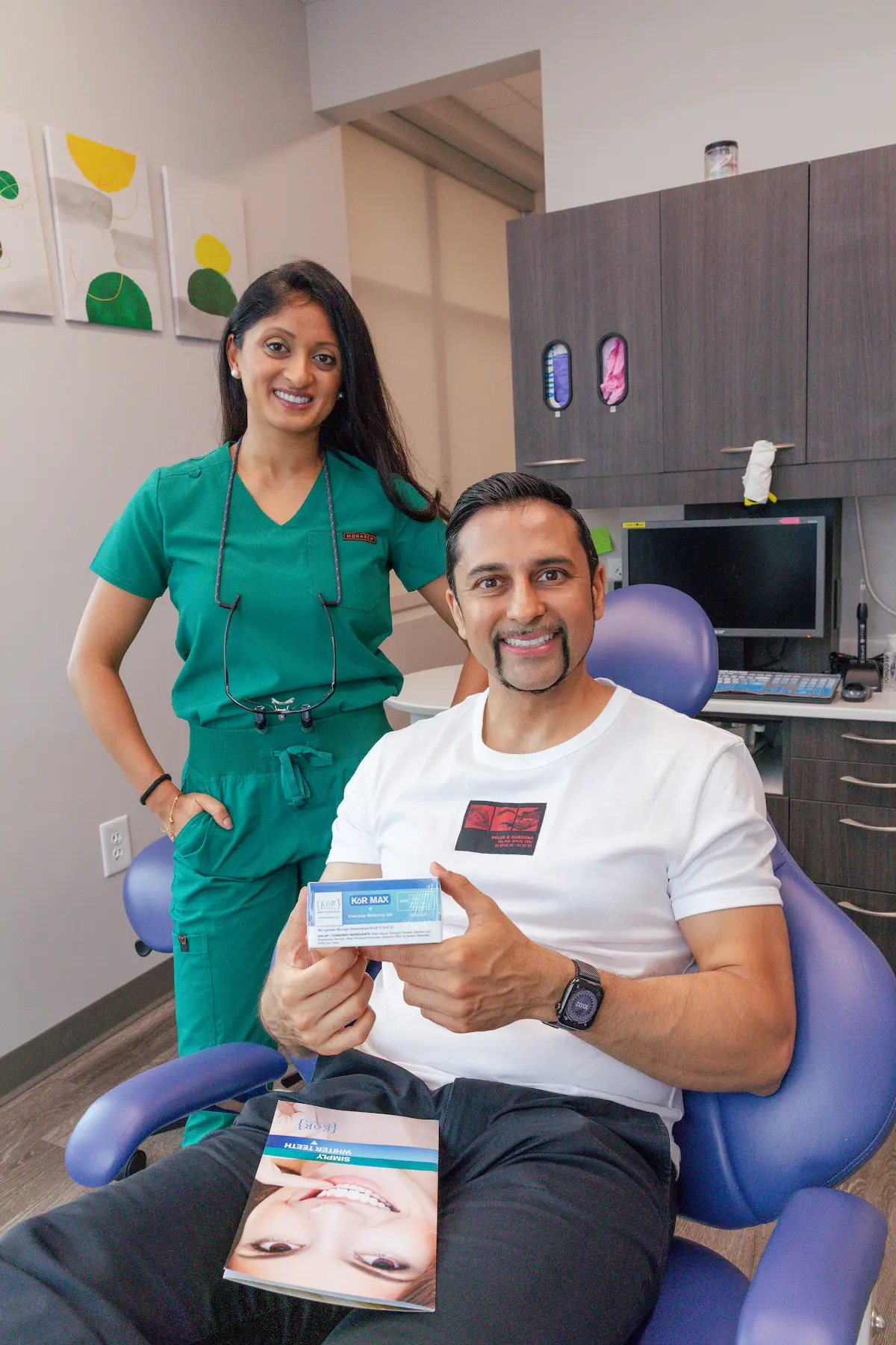 Dr. Patel with a happy patient after emergency dental treatment