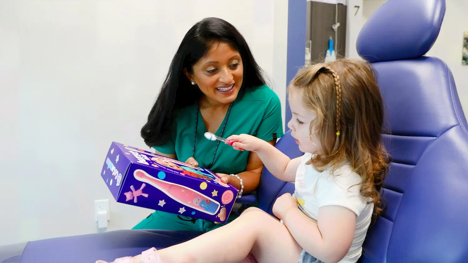 Dr. Patel with a young patient at Ballantyne Family Dentistry